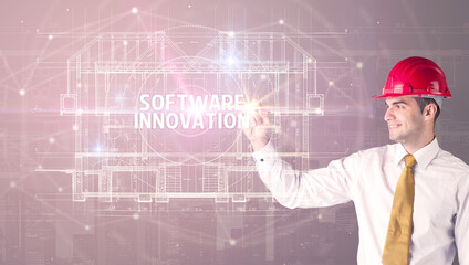 Handsome architect drawing with helmet