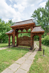 Obraz premium Old wooden door in a park in the center of Bucharest, Romania
