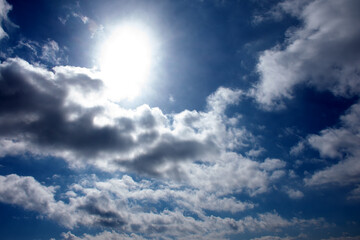 Naklejka na ściany i meble Blue sky clouds and sun