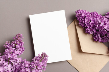 Wedding invitation card mockup with envelope and spring lilac flowers