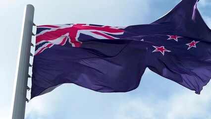 New Zealand, flag is fluttering in the wind photo on the background of the sky, outdoors. National flag