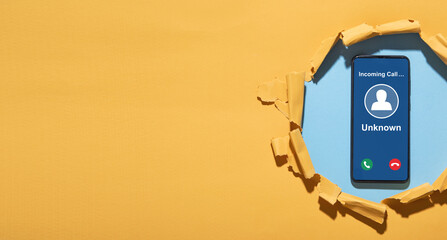 Mobile phone with incoming call from unknown caller.