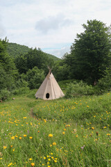 wigwam on a mountain meadow.. © Alla