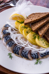 Herring with baked potatoes and onions