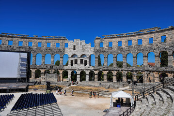 Fototapeta premium Pula, Croatia - 07 07 2022: Photography of ancient walls and architectural detail of arena in Pula from Roman period.