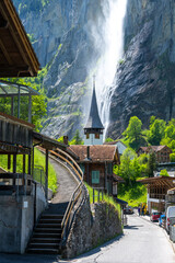 church in alpine village Lauterbrunnen in Switzerland - 517363418
