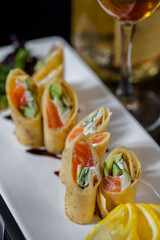 Pancakes with salmon and wine