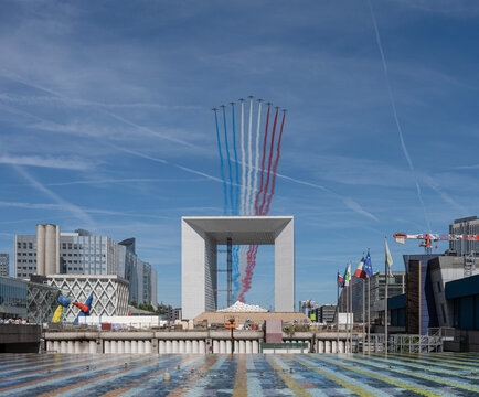 Paris, France - 07 17 2022: Air show of July 14. Alphajet of the patrol of France flying above the district of La Defense