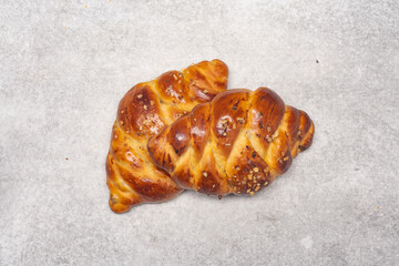 Homemade braided challah bread on vintage background