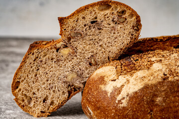 Whole wheat bread, wholemeal bread on vintage background