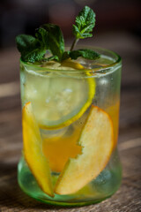 Cocktail with ice, mint, apples and lemon
