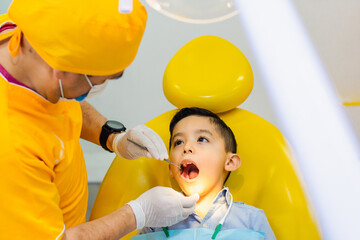 kid getting a dental examination 