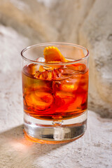 Cocktail with ice and orange peel