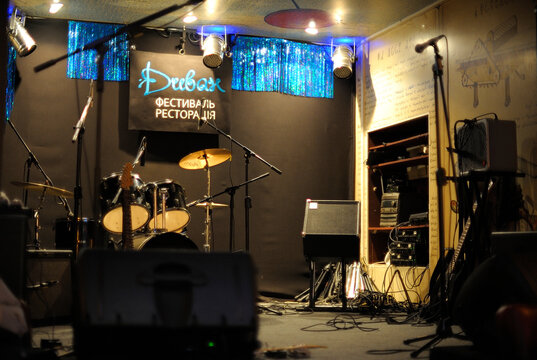 Stage in the art cafe Divan, musical instruments and equipment set before concert. Kyiv, Ukraine