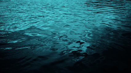 Blue green water. Ripples. Reflection of light. Little waves. Gradient. Dark teal color sea...