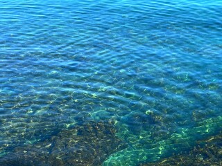 Blue turquoise rippled water in the sea.