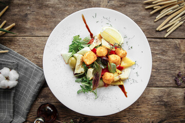 Closeup on gourmet dish with artichokes and deep fried cheese