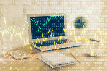 Forex market chart hologram and personal computer background. Multi exposure. Concept of investment.