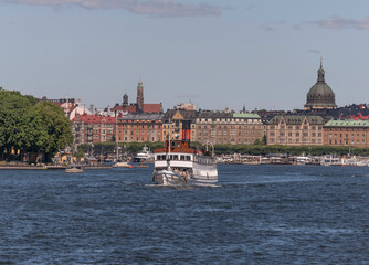 Fototapeta premium Steam boat leaving for tourist trip the archipelago a sunny summer day in Stockholm