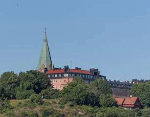 Church and apartment buildings in the district Södermalm a sunny summer day in Stockholm