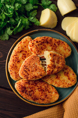 Chvishtari, corn flour tortillas with cheese, pastries, Georgian cuisine, Mchadi, homemade, top view, on a wooden table, no people,