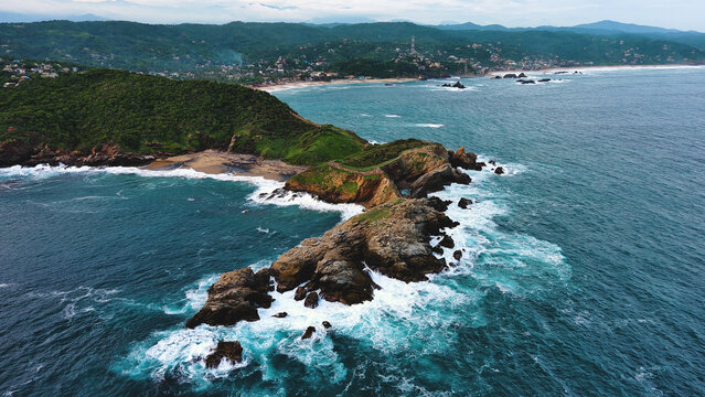 mazunte Oaxaca Mexico punta cometa cliff ocean pacific tropical beach scenic aerial drone 
