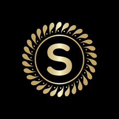 Fototapeta premium Initial S Golden leaf and circle logo design vector. Golden beauty S Logo and business symbol and alphabets vector design