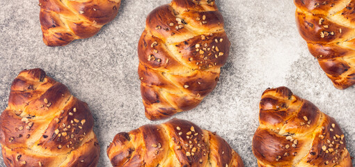 Homemade braided challah bread on vintage background