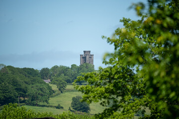 a Neo-Gothic folly tower, situated on a hilltop 