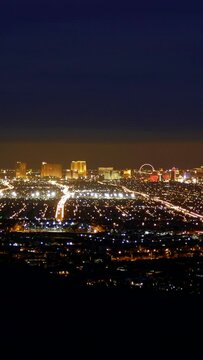 Las Vegas Nevada dusk to night vertical cityscape mountaintop time lapse video.