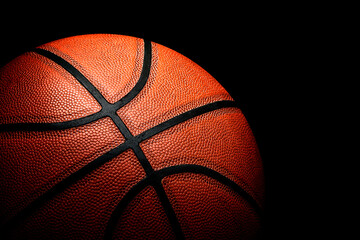 Basketball on black background.