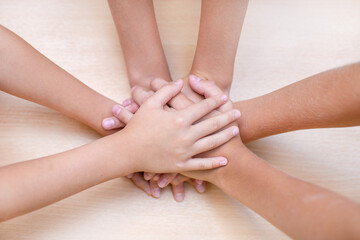 Fototapeta na wymiar The children put their hands on each other. Concept of friendship. Concept of teamwork.