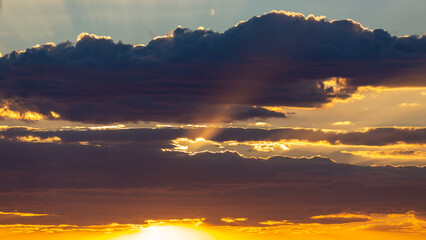 Beautiful monsoon skies above the Sonoran Desert, rays of light, sun beams shooting out from the clouds. Heaven like cloudscapes with dramatic colors and details in Tucson, Arizona, USA.
