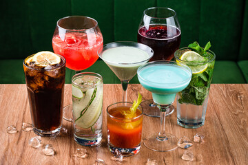 Set of various alcohol cocktails on table