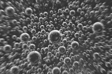 Dark oil with bubbles. Bubbles in liquid. Black and white. Oil concept. Oil business concept and petrol production