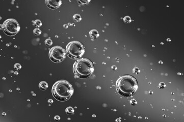 Dark oil with bubbles. Bubbles in liquid. Black and white. Oil concept. Oil business concept and petrol production