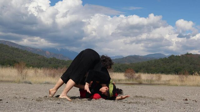 Dancer improvising an intimate dance on the floor. contact with the dancer, on the floor, dance performance, improvisation