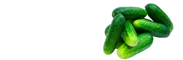 Cercles muraux Légumes frais green cucumbers on a white background. ripe gherkins on a table. fresh vegetables on a light texture. the concept of growing cucumbers
