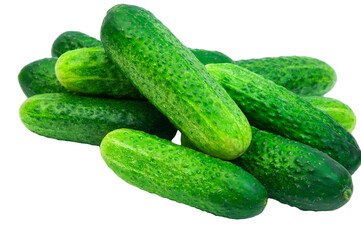 green cucumbers on a white background. ripe gherkins on a table. fresh vegetables on a light texture. the concept of growing cucumbers