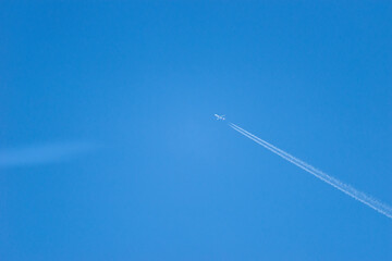trace of an airplane in the blue sky