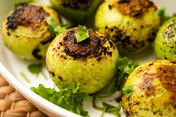 Indian style Tinda or Tinde ki Sabzi also called Indian squash, round melon, Indian round gourd or Indian baby pumpkin, stuffed, stir fried dry or curry recipe