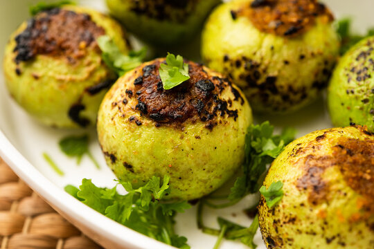 Indian style Tinda or Tinde ki Sabzi also called Indian squash, round melon, Indian round gourd or Indian baby pumpkin, stuffed, stir fried dry or curry recipe