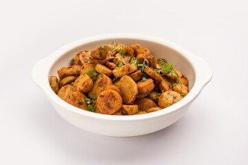 Stir fried taro roots. Arbi ki sabji, ghuiya masala curry Sabzi or arvi dum Masala. Garnished with coriander