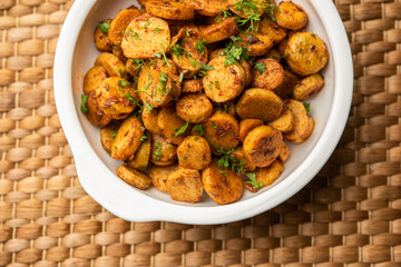 Stir fried taro roots. Arbi ki sabji, ghuiya masala curry Sabzi or arvi dum Masala. Garnished with coriander