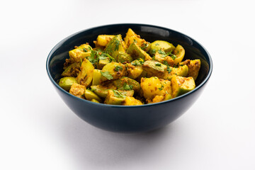 Indian style Tinda or Tinde ki Sabzi also called Indian squash, round melon, Indian round gourd or Indian baby pumpkin, stuffed, stir fried dry or curry recipe
