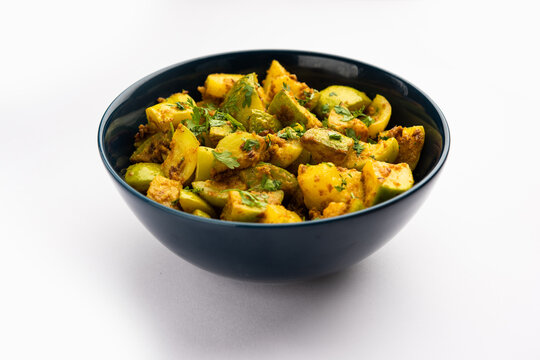 Indian style Tinda or Tinde ki Sabzi also called Indian squash, round melon, Indian round gourd or Indian baby pumpkin, stuffed, stir fried dry or curry recipe