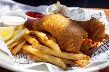 Fish and chips with french fries on a plate