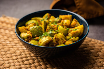 Indian style Tinda or Tinde ki Sabzi also called Indian squash, round melon, Indian round gourd or Indian baby pumpkin, stuffed, stir fried dry or curry recipe