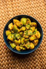 Indian style Tinda or Tinde ki Sabzi also called Indian squash, round melon, Indian round gourd or Indian baby pumpkin, stuffed, stir fried dry or curry recipe