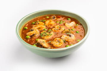 Mushroom and Pea Curry with Roasted Garlic, Indian food served in a bowl